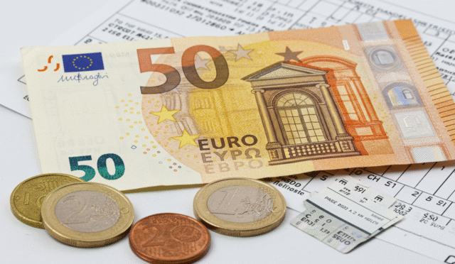 a detailed close-up of a Euro banknote and coins next to a small stack of legal papers create in horizontal format do not write text on image